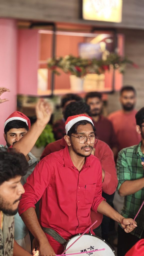 An Innovature employee drumming to the tune and having a good time